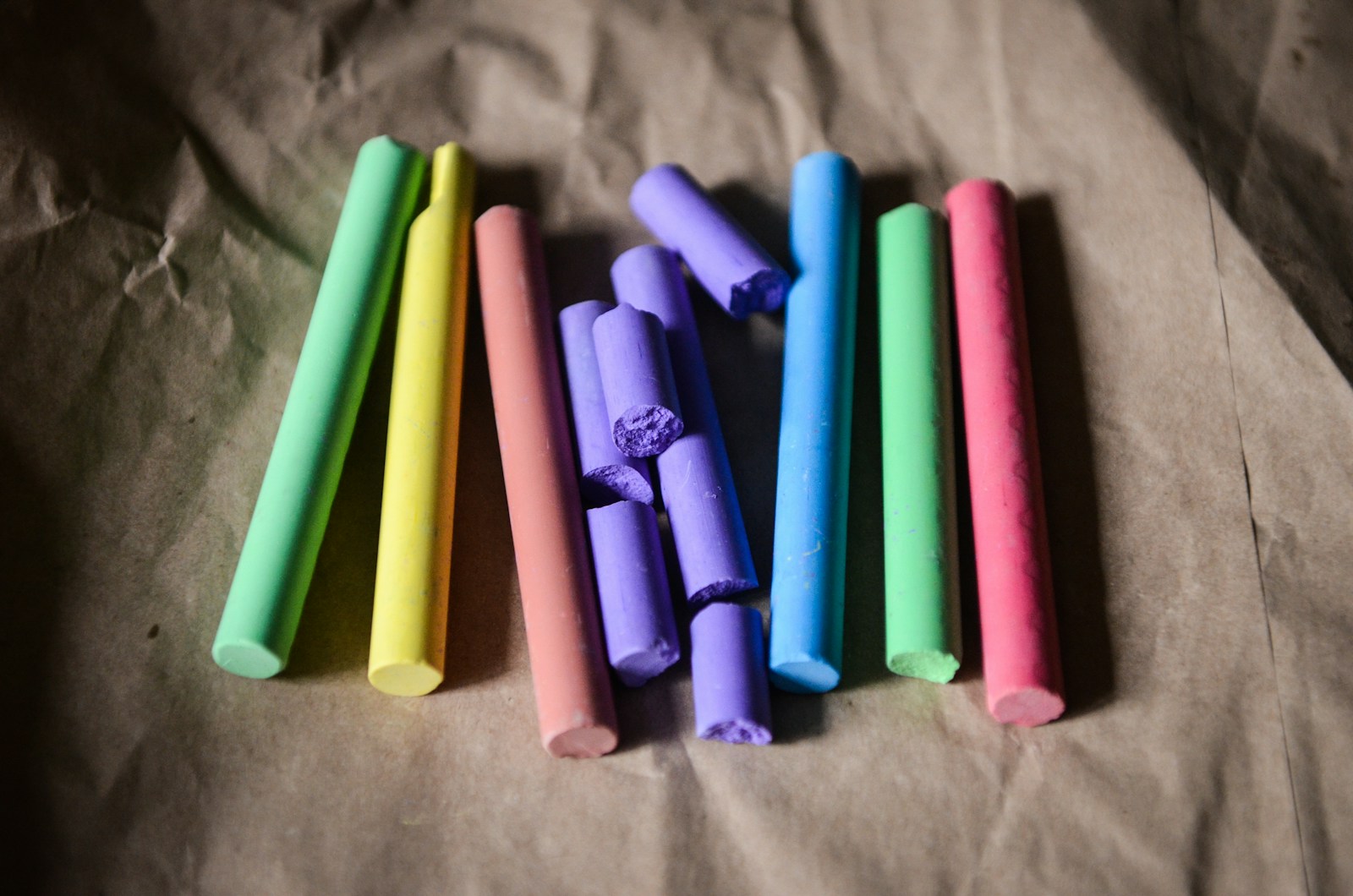 seven assorted-color of chalks gray surface